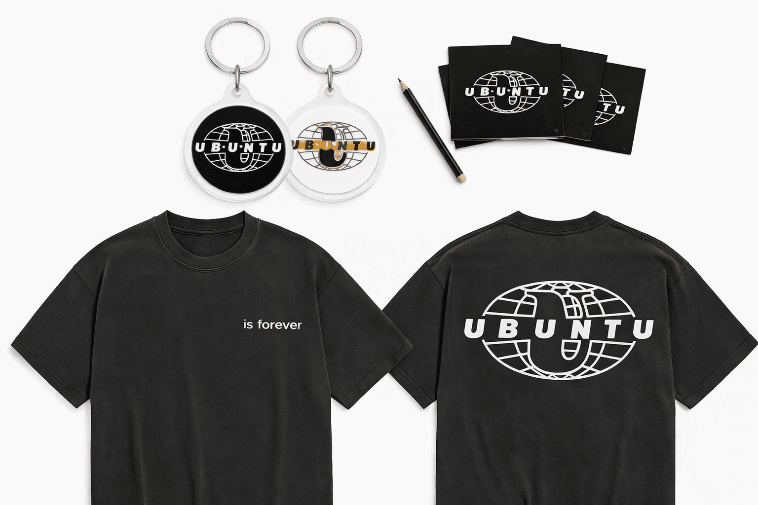 Ubuntu tee, keyrings and cards laid out on a white table